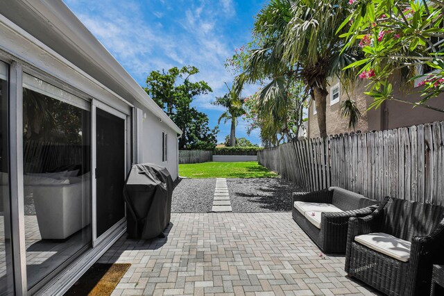 9794 Ridgecreek Rd, Boca Raton, FL 33496 - view of patio / terrace with a fenced backyard and a grill