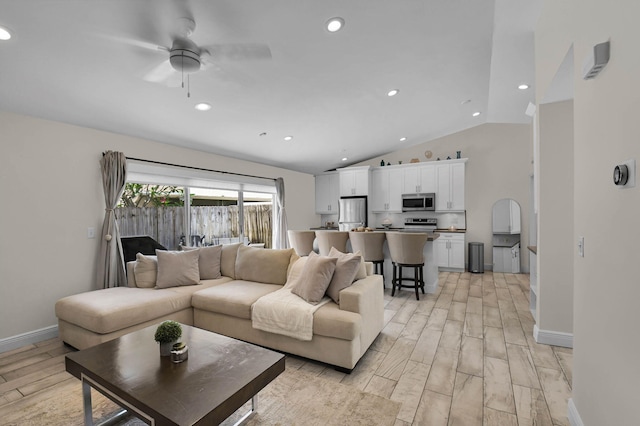 9794 Ridgecreek Rd, Boca Raton, FL 33496 - living room featuring a ceiling fan, light wood-type flooring, vaulted ceiling, baseboards, and recessed lighting