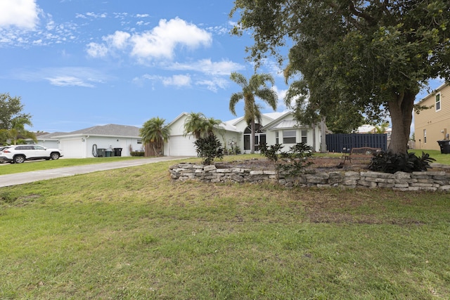 single story home with driveway and an attached garage