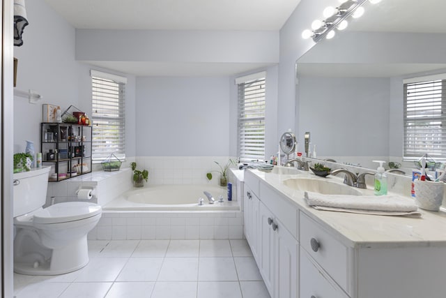full bathroom with a bath, tile patterned floors, toilet, and healthy amount of natural light