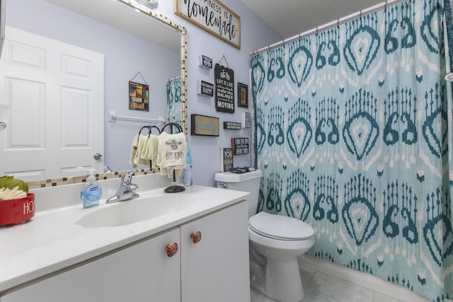 bathroom featuring tile patterned floors, toilet, vanity, and a shower with shower curtain