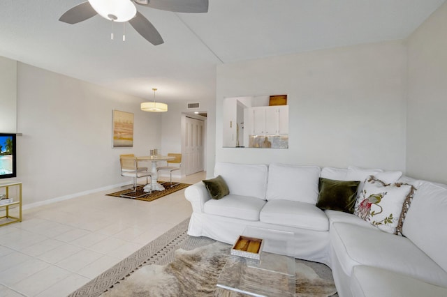 4030 Durham B, Deerfield Beach, FL 33442 - living room featuring a ceiling fan, baseboards, and light tile patterned floors