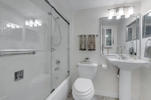 4030 Durham B, Deerfield Beach, FL 33442 - full bathroom with toilet, bath / shower combo with glass door, and baseboards