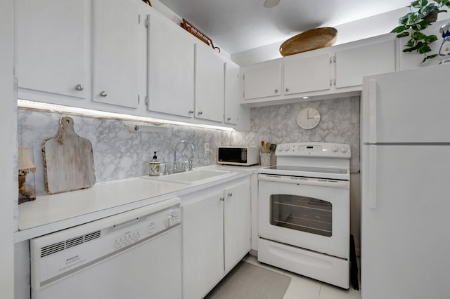 4030 Durham B, Deerfield Beach, FL 33442 - kitchen with white appliances, a sink, tasteful backsplash, light countertops, and white cabinets