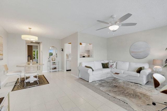 4030 Durham B, Deerfield Beach, FL 33442 - living area featuring ceiling fan, baseboards, and light tile patterned flooring