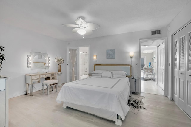 4030 Durham B, Deerfield Beach, FL 33442 - bedroom with light wood-style flooring, ceiling fan, ensuite bathroom, attic access, and baseboards