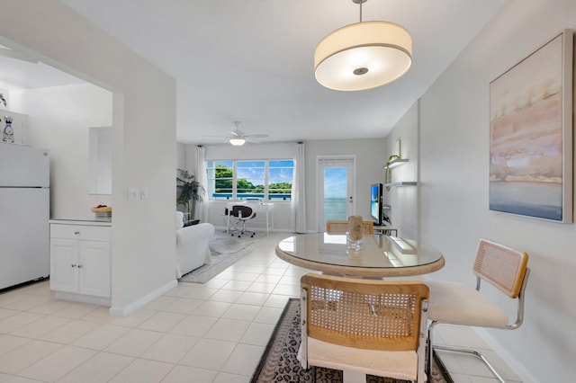 4030 Durham B, Deerfield Beach, FL 33442 - dining space featuring baseboards, a ceiling fan, and light tile patterned floors