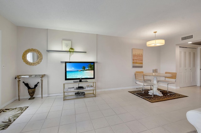 4030 Durham B, Deerfield Beach, FL 33442 - living room featuring baseboards and light tile patterned flooring