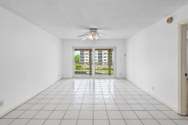 2871 N Ocean Blvd Unit M334, Boca Raton, FL 33431 - spare room with ceiling fan, a textured ceiling, light tile patterned floors, and a smoke detector