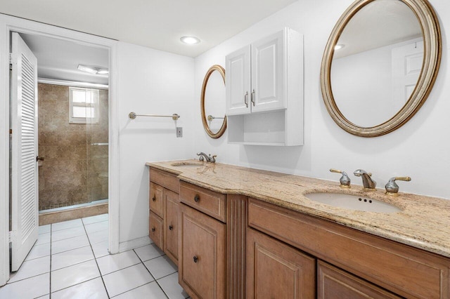 2871 N Ocean Blvd Unit M334, Boca Raton, FL 33431 - full bathroom with a shower stall, tile patterned floors, and double vanity
