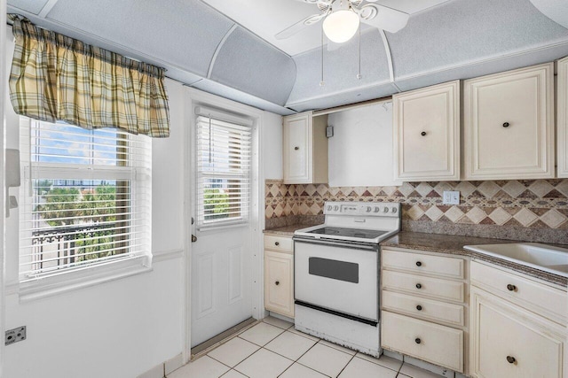 2871 N Ocean Blvd Unit M334, Boca Raton, FL 33431 - kitchen featuring electric range, light tile patterned flooring, decorative backsplash, a ceiling fan, and a sink