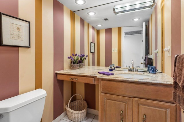 2871 N Ocean Blvd Unit M334, Boca Raton, FL 33431 - bathroom with toilet, vanity, wallpapered walls, and tile patterned flooring