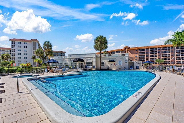 2871 N Ocean Blvd Unit M334, Boca Raton, FL 33431 - community pool with fence and a patio area