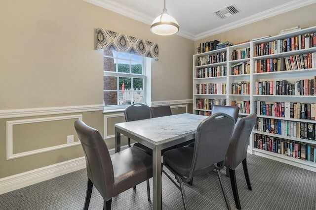2871 N Ocean Blvd Unit M334, Boca Raton, FL 33431 - carpeted dining space featuring crown molding and wainscoting