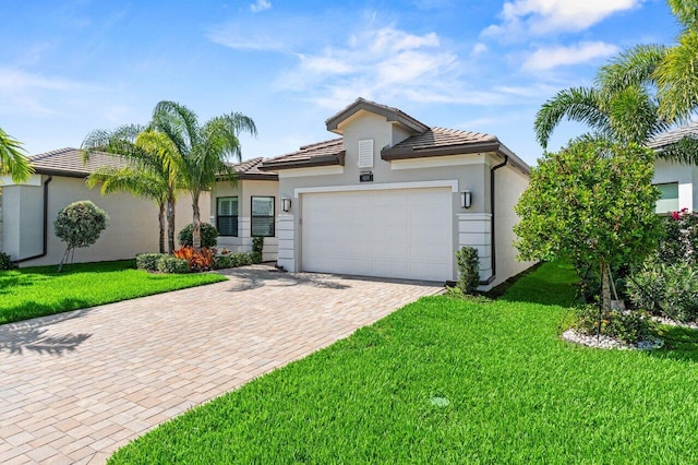 9333 Mountain Pine Grv, Boynton Beach, FL 33473 - view of front of house featuring a garage, decorative driveway, stucco siding, and a front yard