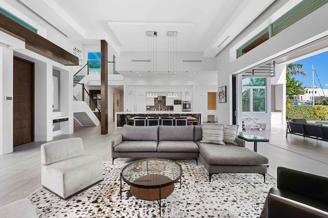 120 N Gordon Rd Share A, Unit Share A, Fort Lauderdale, FL 33301 - living room with a high ceiling, stairs, and wood finished floors