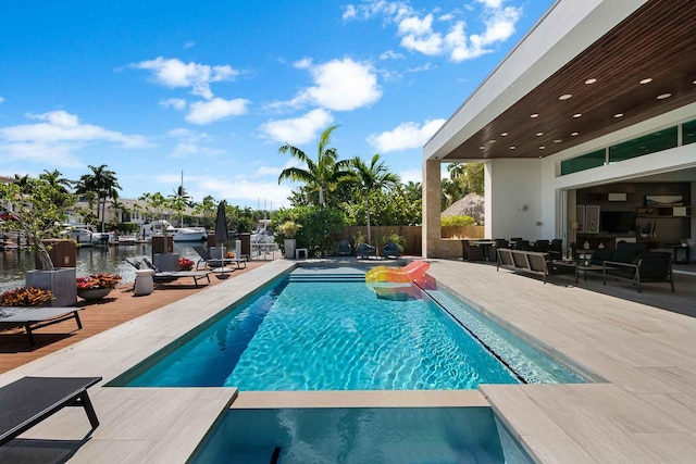 120 N Gordon Rd Share A, Unit Share A, Fort Lauderdale, FL 33301 - view of pool featuring a patio, a pool with connected hot tub, fence, and a water view