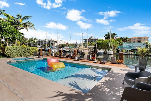 120 N Gordon Rd Share A, Unit Share A, Fort Lauderdale, FL 33301 - view of swimming pool with a boat dock, a pool with connected hot tub, and a water view