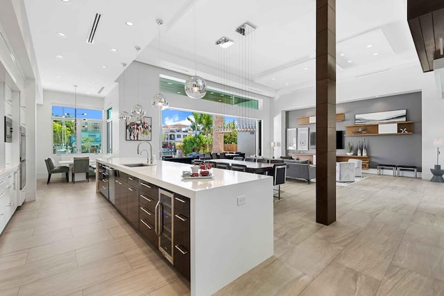 120 N Gordon Rd Share A, Unit Share A, Fort Lauderdale, FL 33301 - kitchen with modern cabinets, a spacious island, a towering ceiling, a sink, and light countertops