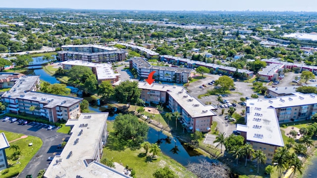 bird's eye view of a nearby body of water and apartment complex / building