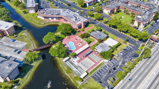 aerial view of property's location with a nearby body of water