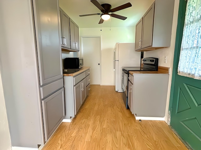 851 Riverside Dr, Moore Haven, FL 33471 - kitchen featuring appliances with stainless steel finishes, gray cabinets, light wood-style floors, and a ceiling fan