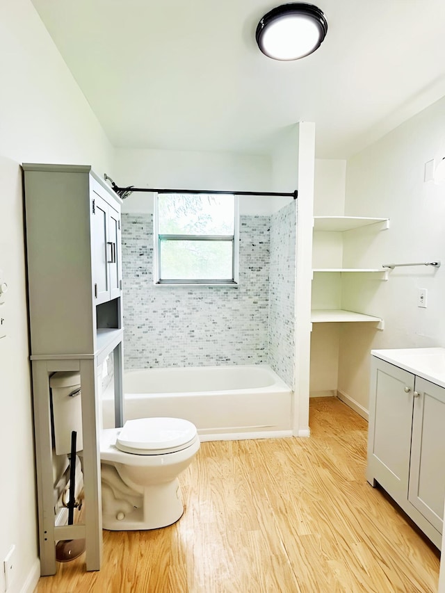 851 Riverside Dr, Moore Haven, FL 33471 - full bathroom featuring wood finished floors, toilet, shower / bath combination, vanity, and baseboards