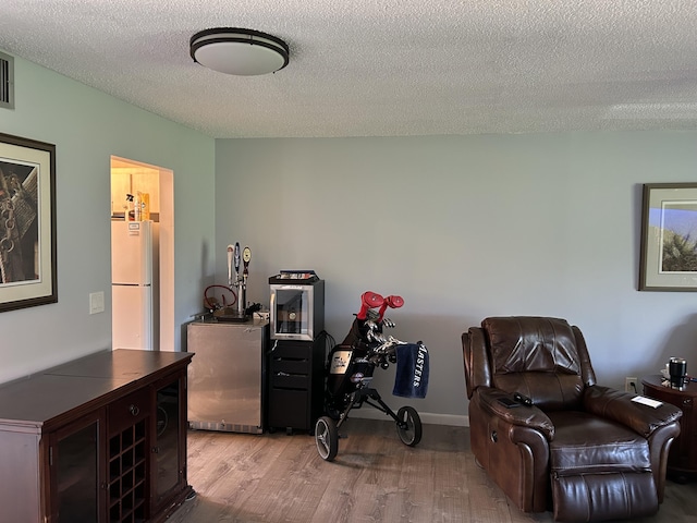 office area featuring a textured ceiling and wood finished floors