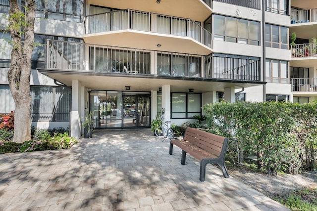 view of apartment building / complex featuring a carport