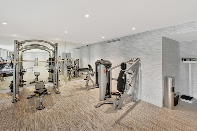 exercise room featuring recessed lighting and carpet