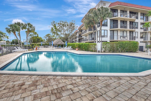 community pool featuring fence