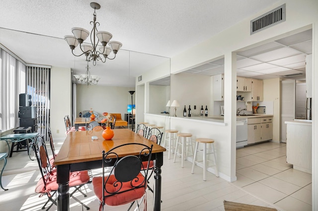 dining space featuring a chandelier