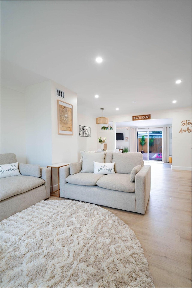 1445 Cindy Dr, Lake Worth Beach, FL 33461 - living area with light wood-style floors and recessed lighting