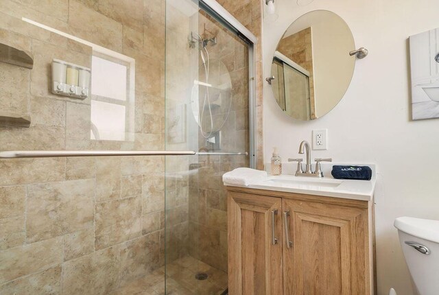 1445 Cindy Dr, Lake Worth Beach, FL 33461 - bathroom with a shower stall, toilet, and vanity