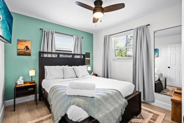 1445 Cindy Dr, Lake Worth Beach, FL 33461 - bedroom with light wood-style floors, baseboards, and a ceiling fan