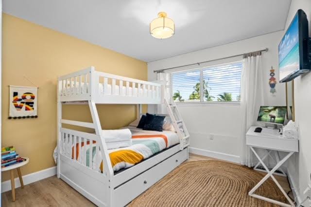 1445 Cindy Dr, Lake Worth Beach, FL 33461 - bedroom with wood finished floors and baseboards