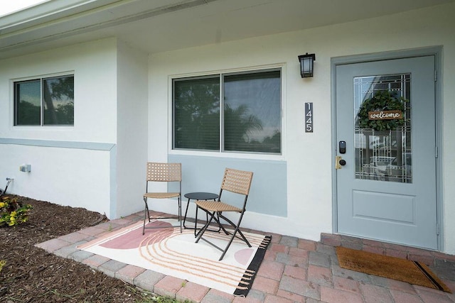 1445 Cindy Dr, Lake Worth Beach, FL 33461 - view of exterior entry featuring stucco siding