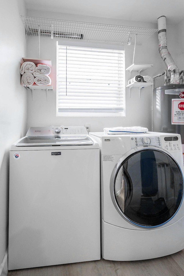 1445 Cindy Dr, Lake Worth Beach, FL 33461 - laundry area with washer and dryer and wood finished floors