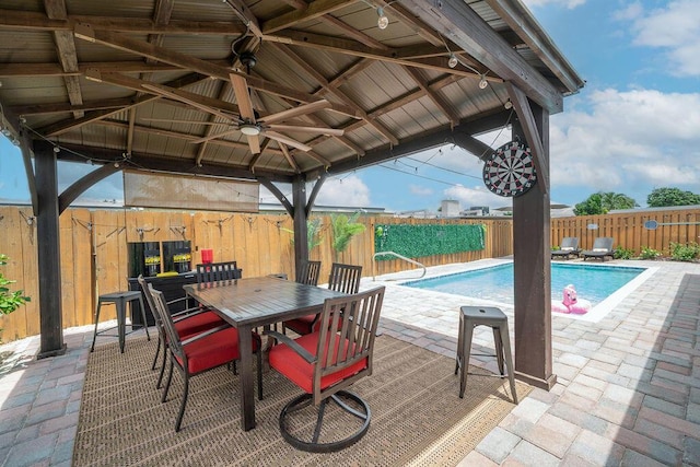 1445 Cindy Dr, Lake Worth Beach, FL 33461 - view of patio / terrace featuring a gazebo, a ceiling fan, a fenced backyard, and outdoor dining space