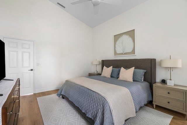 12811 Oak Knoll Dr, Palm Beach Gardens, FL 33418 - bedroom with wood finished floors, baseboards, high vaulted ceiling, and a ceiling fan