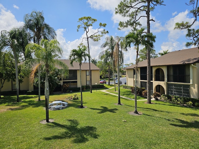 view of community featuring a yard