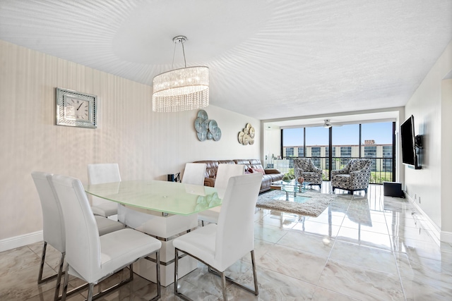7290 Kinghurst Dr Unit 607, Delray Beach, FL 33446 - dining area featuring a wall of windows and a chandelier