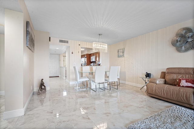 7290 Kinghurst Dr Unit 607, Delray Beach, FL 33446 - dining space featuring marble tiled flooring and a chandelier