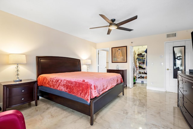 7290 Kinghurst Dr Unit 607, Delray Beach, FL 33446 - bedroom with a spacious closet, a closet, ceiling fan, and light marble finish floors