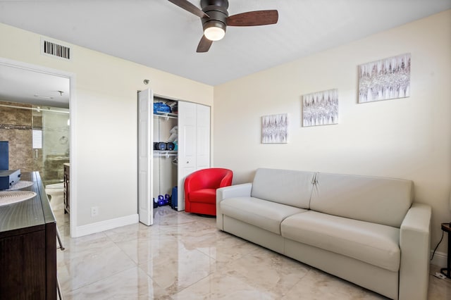 7290 Kinghurst Dr Unit 607, Delray Beach, FL 33446 - living area featuring light marble finish floors and ceiling fan