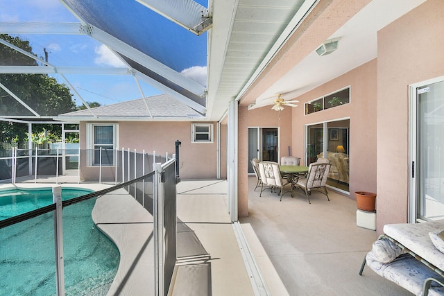 3204 SE Otis Ln, Port Saint Lucie, FL 34984 - view of swimming pool featuring a patio area, outdoor dining space, fence, ceiling fan, and glass enclosure