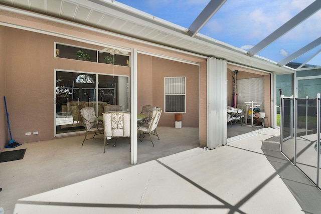 3204 SE Otis Ln, Port Saint Lucie, FL 34984 - view of patio / terrace featuring outdoor dining area and glass enclosure