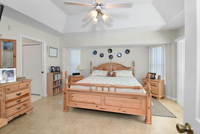 3204 SE Otis Ln, Port Saint Lucie, FL 34984 - bedroom featuring a tray ceiling and a ceiling fan