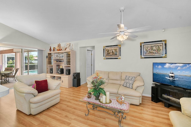 3204 SE Otis Ln, Port Saint Lucie, FL 34984 - living area with light wood finished floors, vaulted ceiling, and a ceiling fan