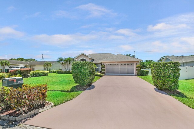 3204 SE Otis Ln, Port Saint Lucie, FL 34984 - ranch-style home featuring an attached garage, concrete driveway, and stucco siding